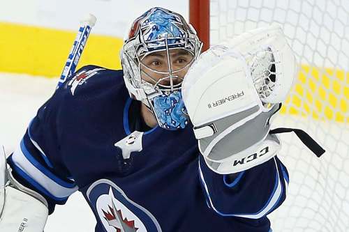 Connor Hellebuyck has posted a 4-4-1 record, a 3.00 goals-against average and .907 save percentage so far this season. (John Woods / The Canadian Press files)