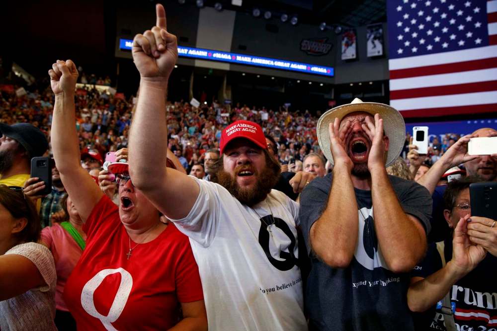 Evan Vucci / The Associated Press Files
Supporters cheer as U.S. President Donald Trump arrives at a campaign rally in Fargo, N.D., in June.