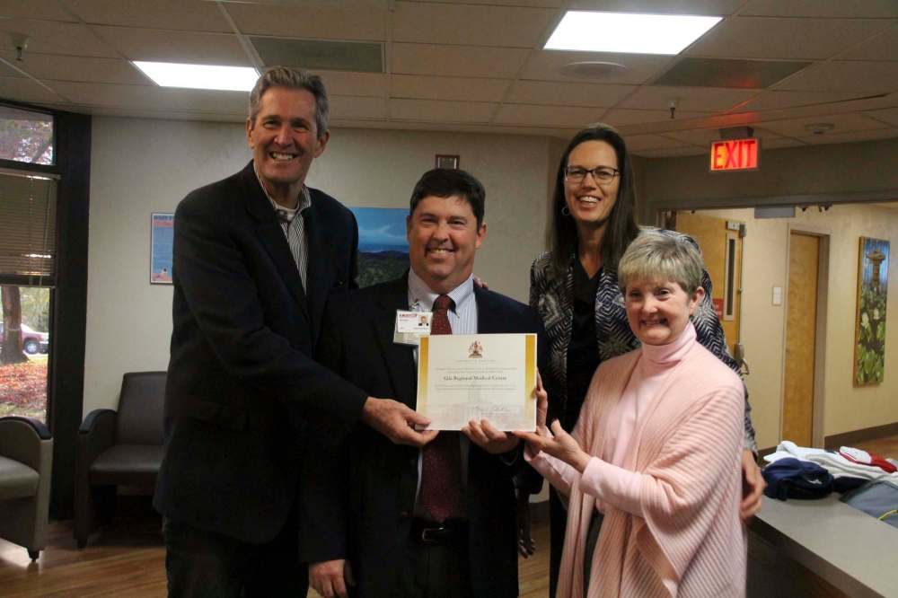 Mary Alice Murphy / Grant County Beat
Premier Brian Pallister and his wife Esther present a certificate of appreciation for the care he received at Gila Regional Medical Center in Silver City, New Mexico in 2017. GRMC Chief Financial Officer Richard Stokes and Chief Executive Officer Taffy Arias accept the certificate.