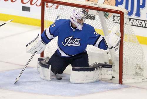 Connor Hellebuyck being lit up from inside the slot at even strength. (Trevor Hagan / Free Press files)
