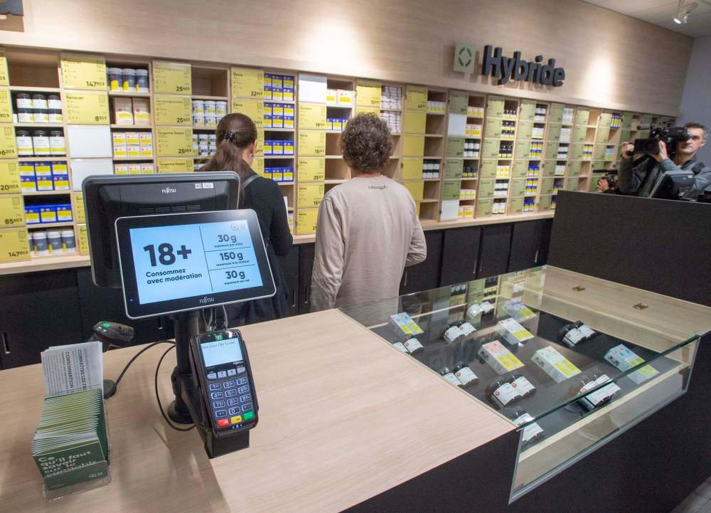 Signs at Societe Quebecoise du Cannabis stores could soon be changed to 21+ after the Coalition Avenir Québec government indroduced legislation Wednesday to raise the legal age for using cannabis. (Ryan Remiorz / The Canadian Press files)
