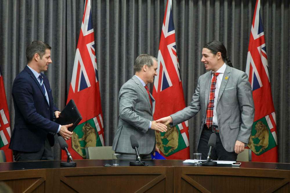 Winnipeg Mayor Brian Bowman (from left), Manitoba Health Minister Cameron Friesen and Winnipeg Centre MP Robert-Falcon Ouellette announced the formation Tuesday of a tri-level task force to deal with illicit drugs and the province's meth crisis. (Mike Deal / Winnipeg Free Press)