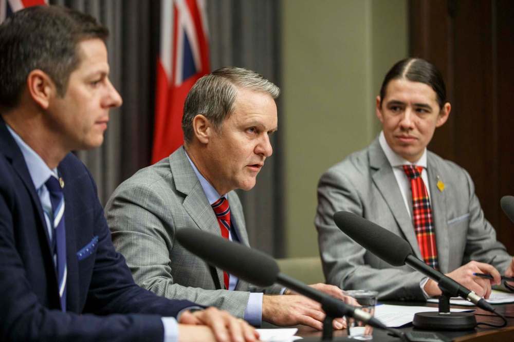 Winnipeg Mayor Brian Bowman (from left), Manitoba Health Minister Cameron Friesen and Winnipeg Centre MP Robert-Falcon Ouellette said the new committee will seek advice from people working in health care, justice, policing and academia, along with people with lived experiences. (Mike Deal / Winnipeg Free Press)