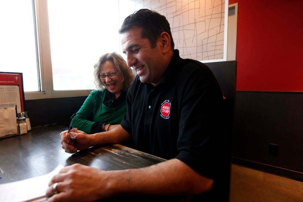 PHIL HOSSACK / WINNIPEG FREE PRESS
Vicky Scouras sold Red Top to Stavros Athanasiadis.