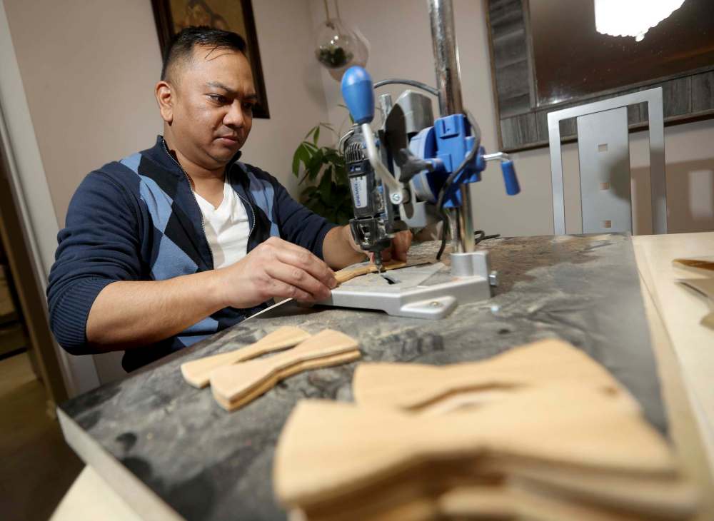 Ryan (pictured) and Eddie say the secret to making their custom bow ties is pairing the right piece of wood with the right fabric.