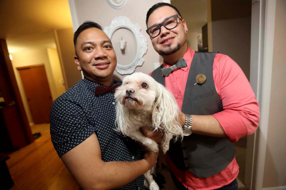 Ryan and Eddie Mendoza, owners of Charlie’s Charmed fashion accessories for men, with their company namesake, Charlie.