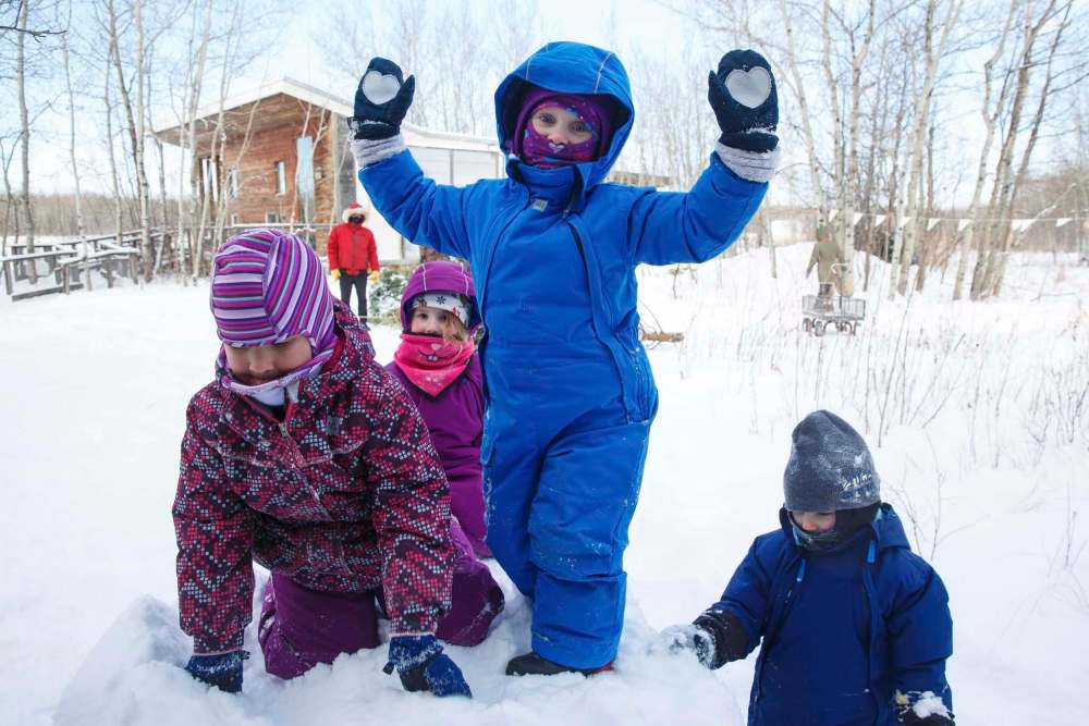 Mike Deal / Winnipeg Free Press
Bailey, 4, (from left) Tessa, 4, Josie, 4, and Neyla, 3, love playing in the snow during self-directed play outdoors Monday morning at the FortWhyte Alive Forest School. A pre-school alternative where kids ages 3 to 5 spend the whole session outdoors in the woods, even in this cold weather.