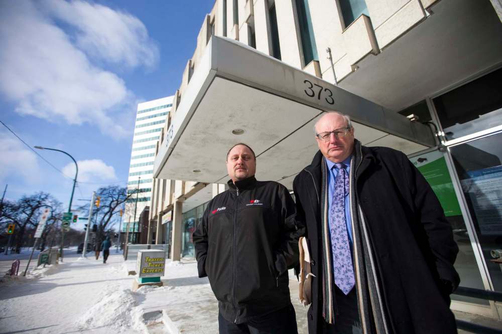 MIKAELA MACKENZIE / WINNIPEG FREE PRESS
Todd Dube, founder of Wise Up Winnipeg (left) and Keith MacCharles, who is fighting two radar tickets, in front of the traffic courts in Winnipeg on Tuesday.