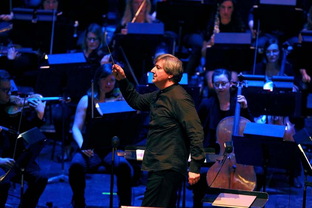Conductor Daniel Raiskin led the WSO on a white-knuckle thrill ride while playing with prog-metal outfit Animals as Leaders. (Phil Hossack / Winnipeg Free Press)