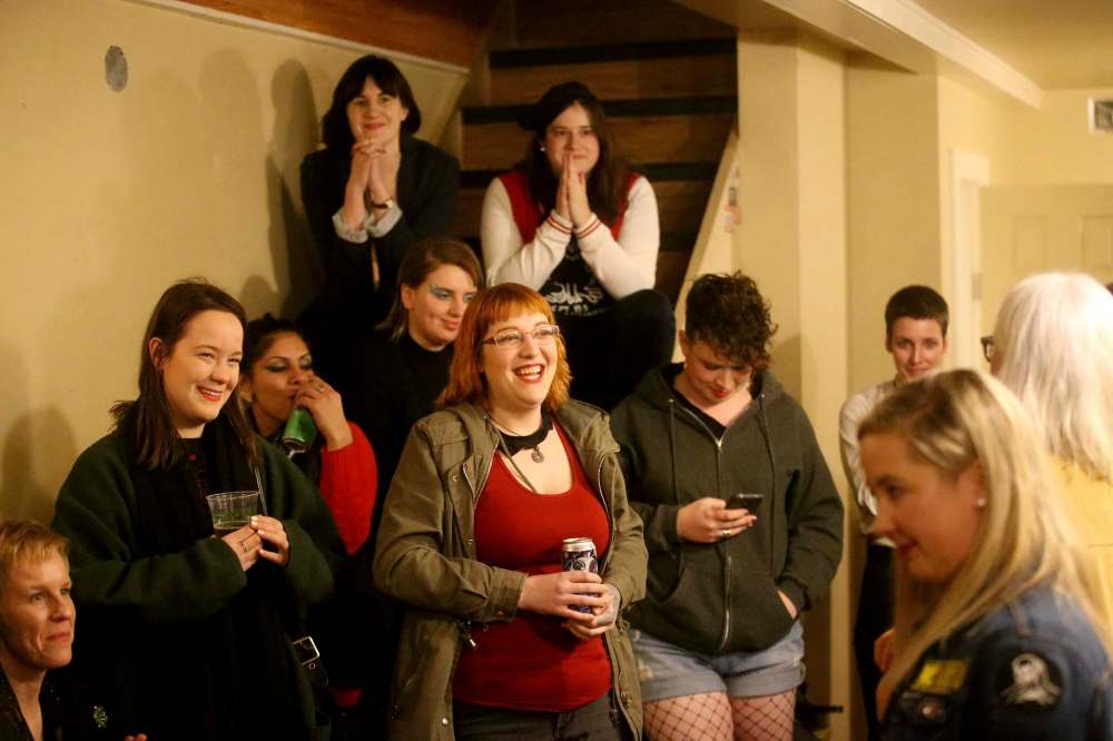 Adult Rock Camp participants try to ease the stage fright prior to their performances at the Park Theatre. (Trevor Hagan / Winnipeg Free Press)