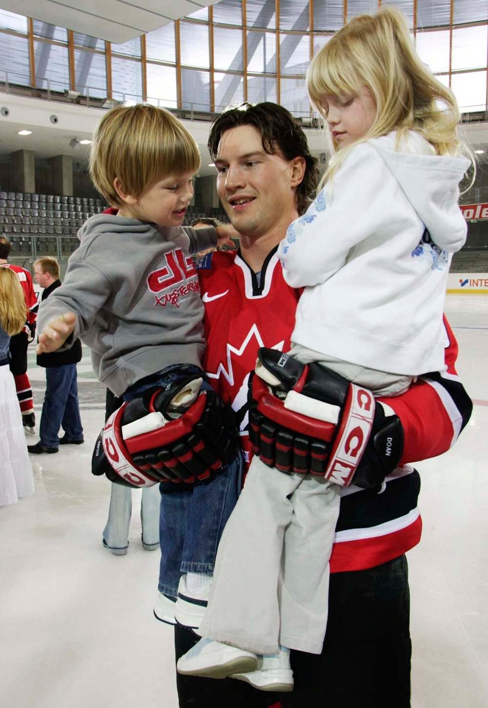 Frank Gunn / The Canadian Press files
Doan carries his son, Josh, and daughter, Karys, prior to a team photo at the IIHF World Hockey Championship in Austria 2005.