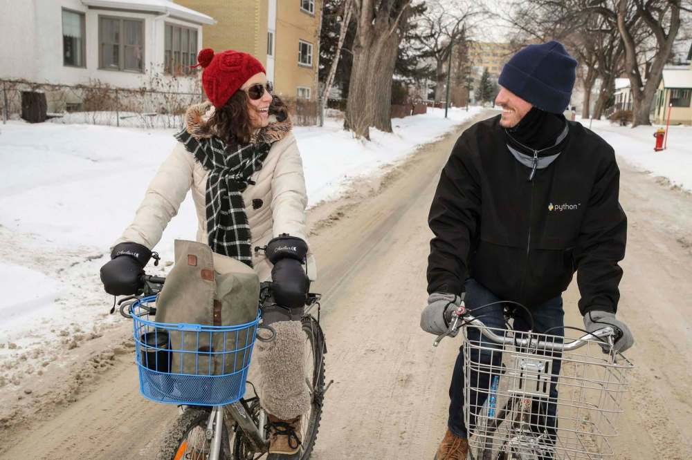 LEIF NORMAN PHOTO
Green Action Centre’s Mel Marginet rides her bike with friend Sean Carlson in Winnipeg.