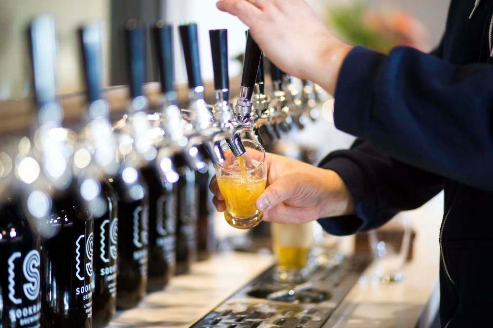 MIKAELA MACKENZIE / WINNIPEG FREE PRESSAndrew Sookram, who's opening a new brewery called Sookram's, pours a flight of beers in the taproom in Winnipeg on Wednesday, March 6, 2019. Winnipeg Free Press 2019.