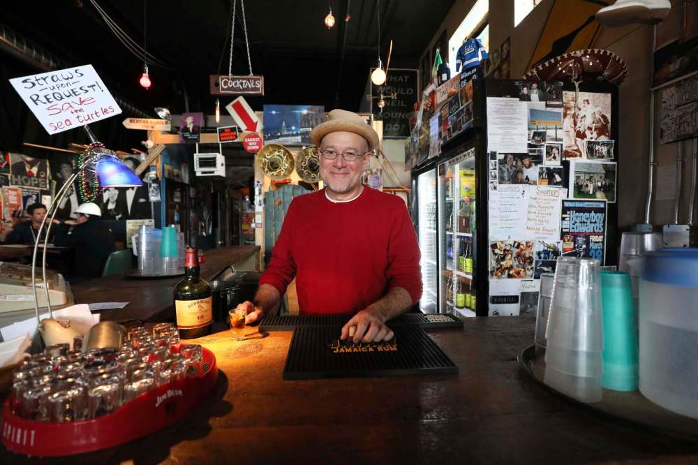 John Scoles mans the bar at the Times Change(d) High and Lonesome Club, which is undergoing renovations that will expand its footprint within the 132-year-old Fortune Building on Main Street. (Ruth Bonneville / Winnipeg Free Press)