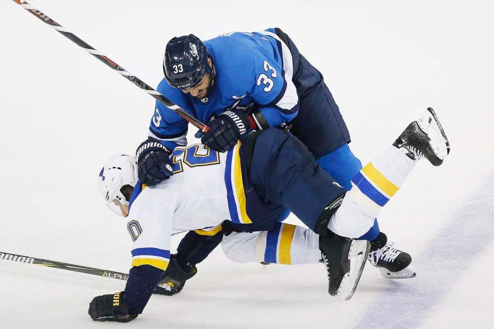 Dustin Byfuglien has only played 37 of 70 games this year, while Morrissey has dressed for 59. The Jets are 36-21-4 when at least one is playing. (John Woods / The Canadian Press files)