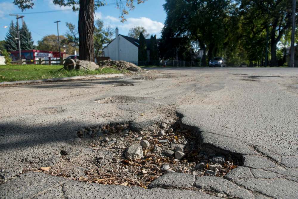 Winnipeggers might get some potholes on their streets patched, but there will be no major residential street reconstruction this year. (David Lipnowski / Winnipeg Free Press files)