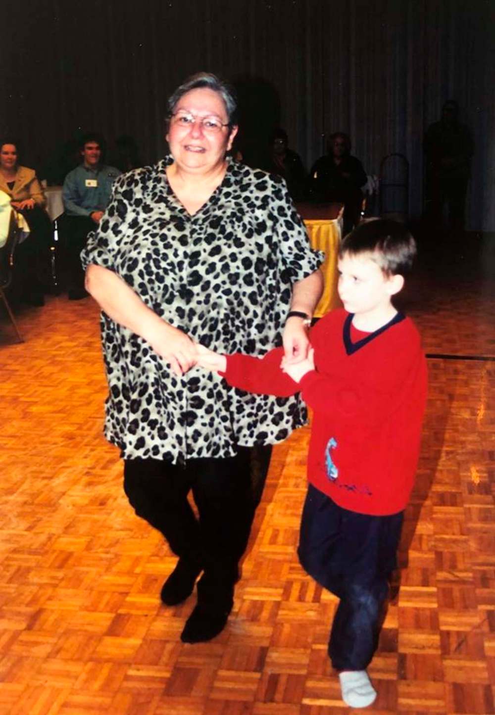 Patricia and her grandson dancing a polka.