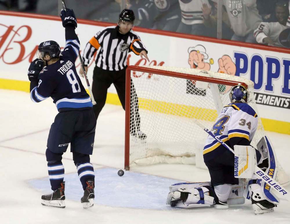 Jacob Trouba celebrates after scoring the winning goal in Winnipeg Oct. 22 against the Blues. The Jets expect a vastly different St. Louis team than the one that lost the season series 3-1. TREVOR HAGAN / THE CANADIAN PRESS FILES