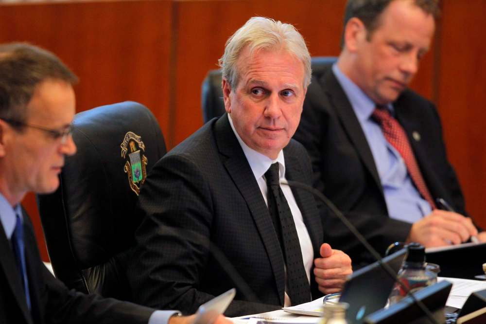 Planning, property and development department director John Kiernan (centre) says his investigation team isn’t satisfied with some of the answers provided by city staff. (Boris Minkevich / Winnipeg Free Press files)
