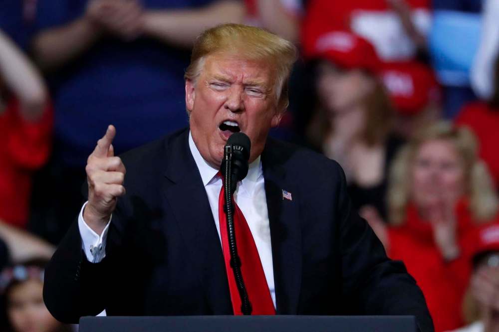 It took 601 days for U.S. President Donald Trump to reach the 5,000-lie mark and another 227 more days to double up to 10,000. (Paul Sancya / The Associated Press files)