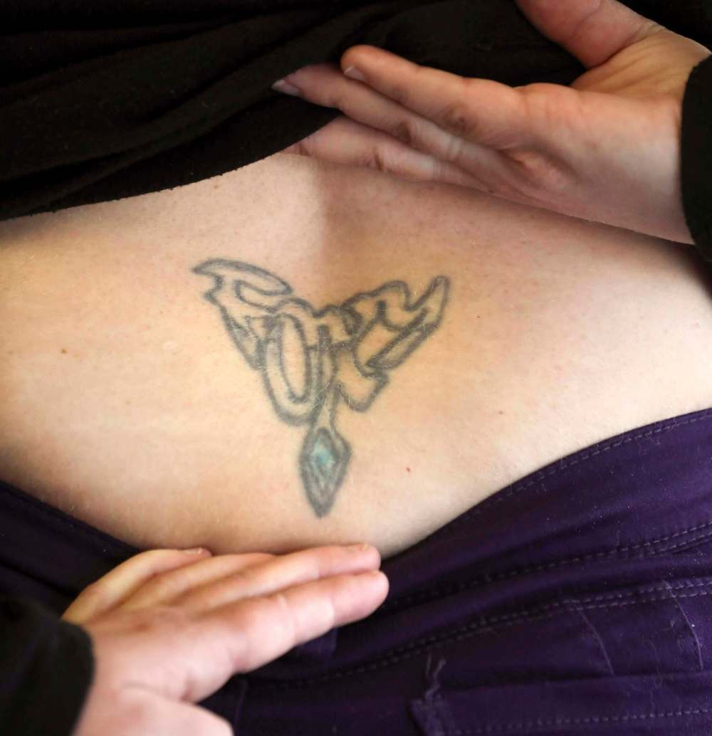 RUTH BONNEVILLE / WINNIPEG FREE PRESS
The coolness factor of Mary Wilson’s lower-back tattoo hasn’t been as permanent as the ink.