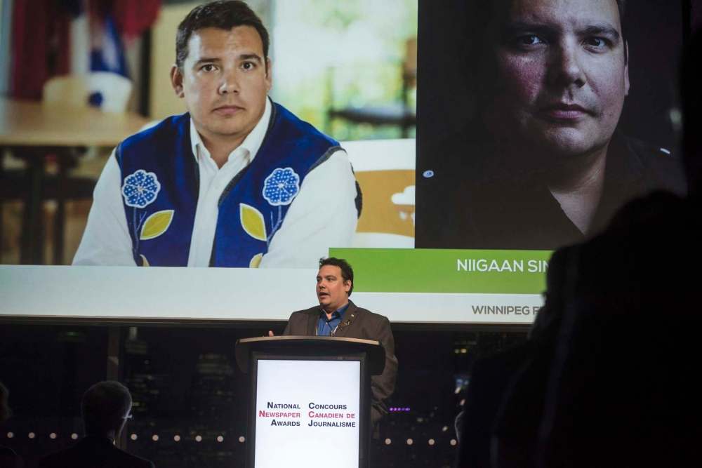 Tijana Martin
/ The Canadian PressNiigaan Sinclair, of the Winnipeg Free Press, accepts the award for his column during the National Newspaper Awards in Toronto on Friday, May 3, 2019.