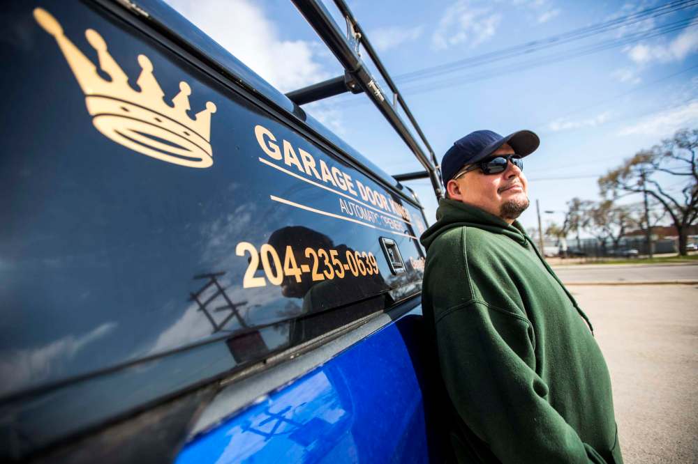 Stan Summers named his business Garage Door King in honour of his late father, Al. ‘That and it sounds good. Nobody’s going to be calling the Garage Door Prince or whatever when there’s an emergency.’ (Mikaela MacKenzie / Winnipeg Free Press)