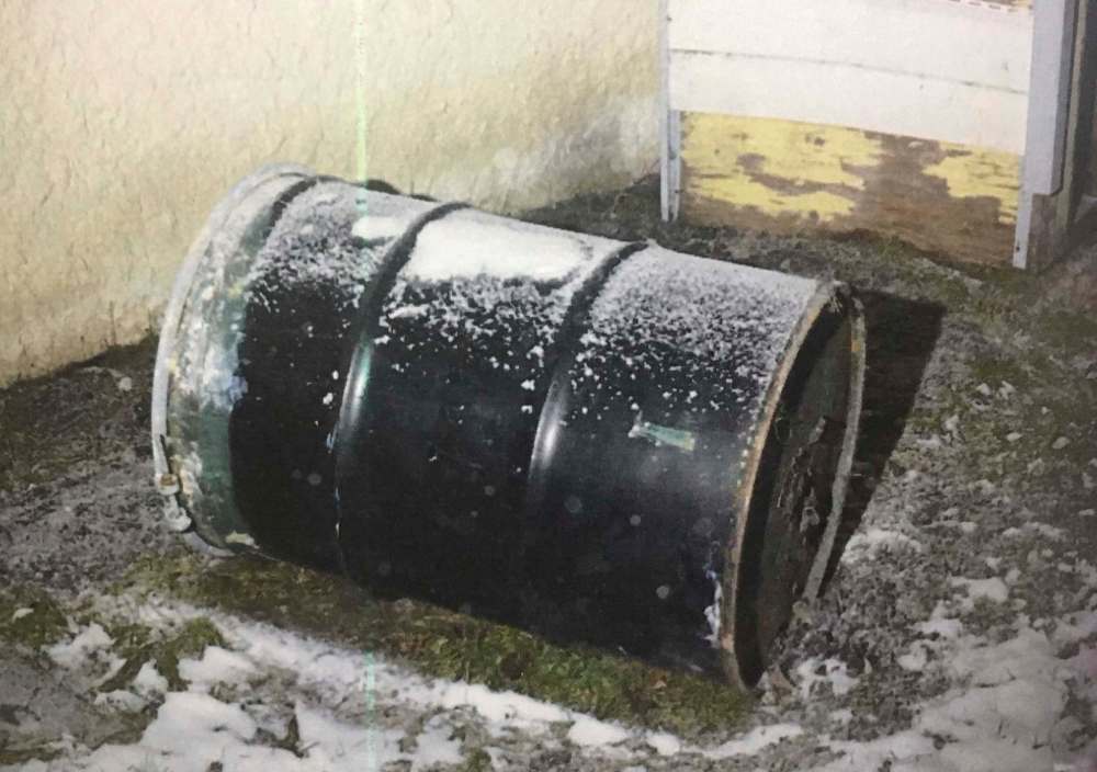 A barrel is seen in a Winnipeg yard in this undated handout photo provided by Manitoba Court of Queen's Bench. Perez Cleveland, 46, has pleaded not guilty in the death of 42-year-old Jennifer Barrett, whose body was found in a barrel behind their Winnipeg home in December 2016.