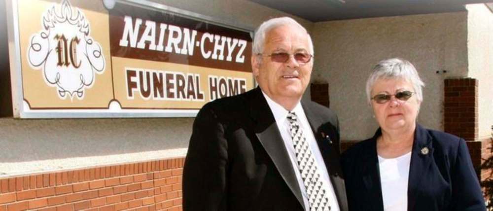 Bob and Diane in front of Nairn-Chyz Funeral Home.