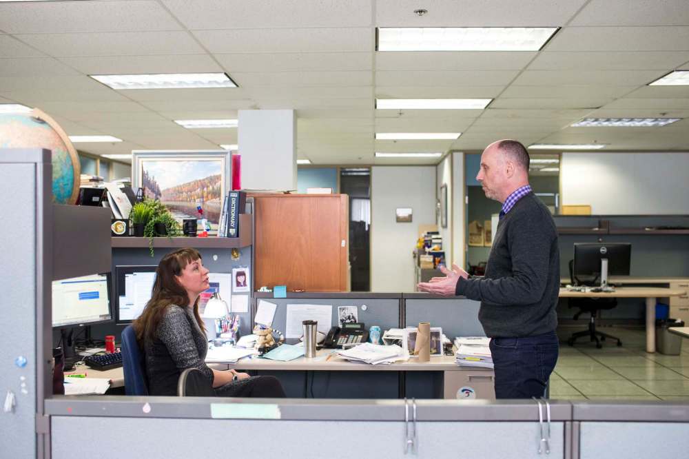 Free Press editor Paul Samyn and Wendy Sawatzky, Associate Editor Digital News, discuss which stories will be included in the Above the Fold online edition highlighting the day’s top news. (Mikaela MacKenzie / Winnipeg Free Press files)
