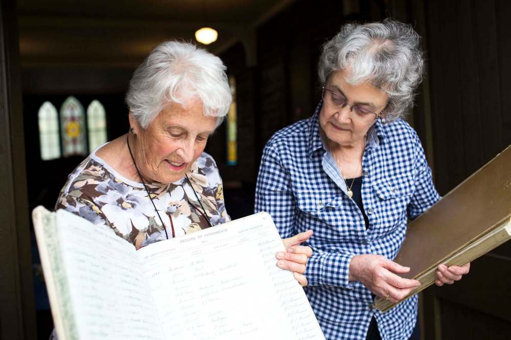 Margaret Steele (left) and Rosalie Gill found records in a missing register at St. James Anglican Church with information about over 2,800 miscarried or stillborn babies. (Mikaela MacKenzie photos / Winnipeg Free Press)