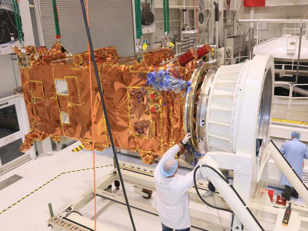 The third RCM spacecraft is about to be inserted in a thermal vacuum chamber for testing at the David Florida Laboratory. (John A. Brebner / Canadian Space Agency)