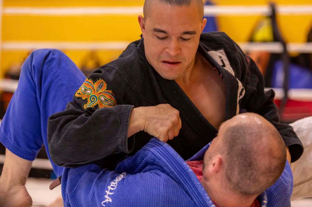 Pang grapples with Dave Lawless, a Jiu Jitsu instructor.