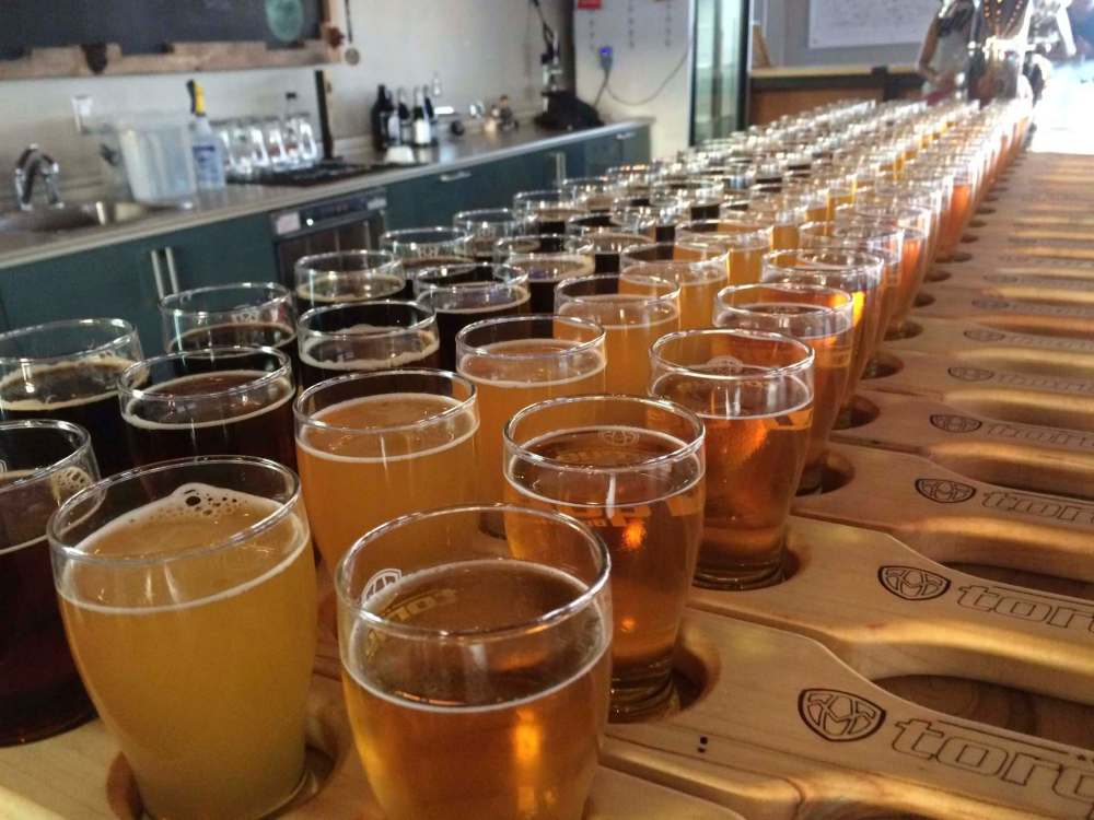 Flights of beer await thirsty patrons on a brewery tour.