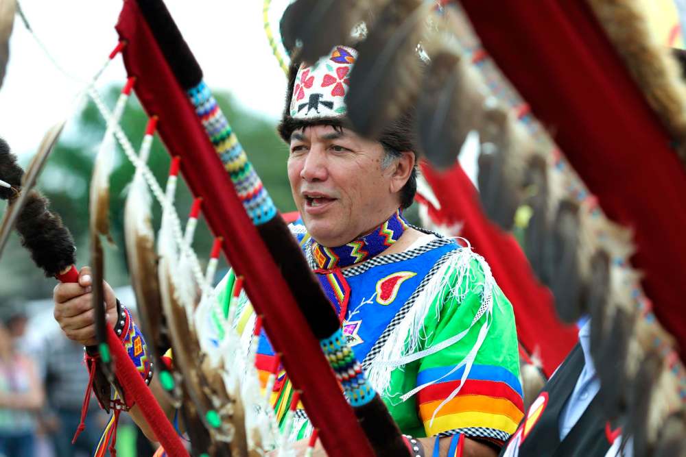 RUTH BONNEVILLE / WINNIPEG FREE PRESS
Chief Dennis Meeches of Long Plain First Nation marches in the grand entry with other chiefs, elders, military officers dignitaries and Indigenous dancers during the celebration ceremony for National Indigenous Peoples Day at Kapyong Barracks Friday.