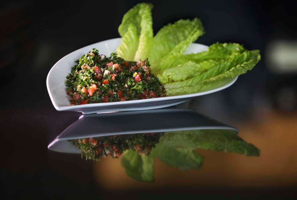 RUTH BONNEVILLE / WINNIPEG FREE PRESS
Resto review - Beaurivage Authentic Lebanese Cuisine.
788 Corydon Ave
Set dinner menu with 3 options, light, supreme or extravaganza all prepared by Chef George Chamaa.
Photos of various dishes from lunch and dinner menu.
Tabbouleh Salad. Authentic Lebanese blend of parsley, fresh mint, green onions, tomatoes, burgle wheat chopped fine and mixed with fresh lemons and virgin olive oil. Served on a bed of romaine lettuce.
See review.
June 24, 2019