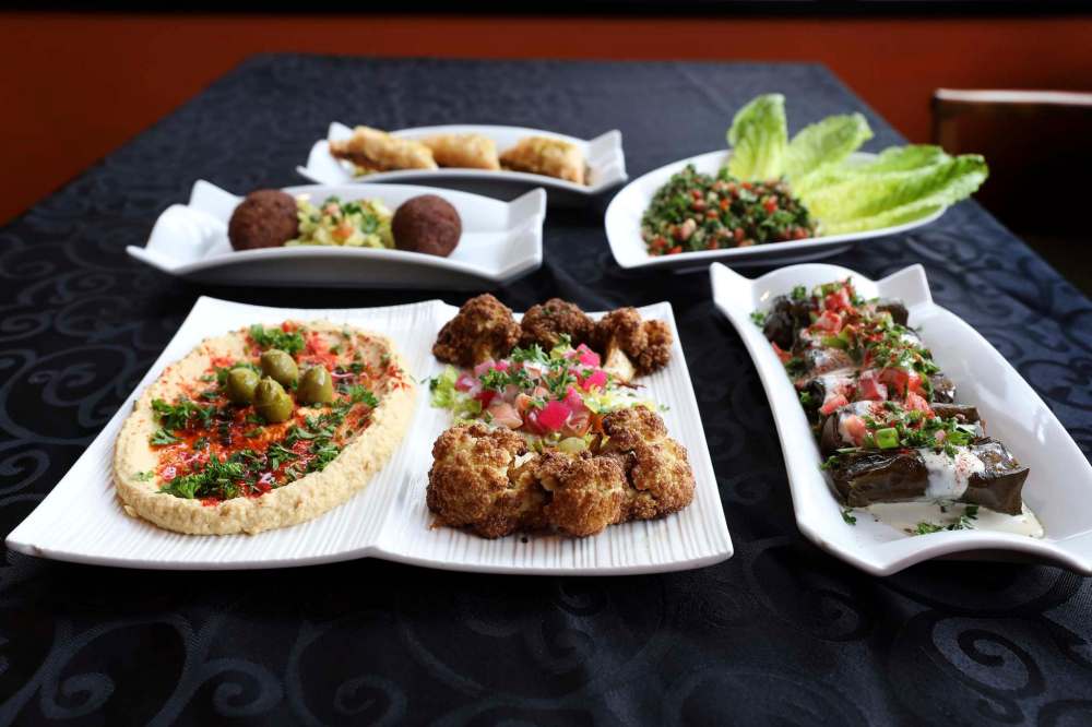 RUTH BONNEVILLE / WINNIPEG FREE PRESS
Resto review - Beaurivage Authentic Lebanese Cuisine.
788 Corydon Ave
Set dinner menu with 3 options, light, supreme or extravaganza all prepared by Chef George Chamaa.
Photos of various dishes from lunch and dinner menu.
Double appetizer plate. Hummus, a blend of tahini and lemon, topped with parsley and served with pita wedges and Rosettes, cauliflower steamed and golden fried with tahini sauce.
Stuffed grape leaves. Rice, onion, tomato, mild special spices flambeed in garlic and mint sauce. Topped with tahini sauce.
Kibbi Balls. A Lebanese delicacy, fresh eye of round minced 3 times, mixed with burgle wheat, onion and mild spices. Filled with ground sirloin, onion and mild spices, served with house salad.
Tabbouleh Salad. Authentic Lebanese blend of parsley, fresh mint, green onions, tomatoes, burgle wheat chopped fine and mixed with fresh lemons and virgin olive oil. Served on a bed of romaine lettuce.
Dessert, traditional Baklava served with Lebanese coffee.
See review.
June 24, 2019