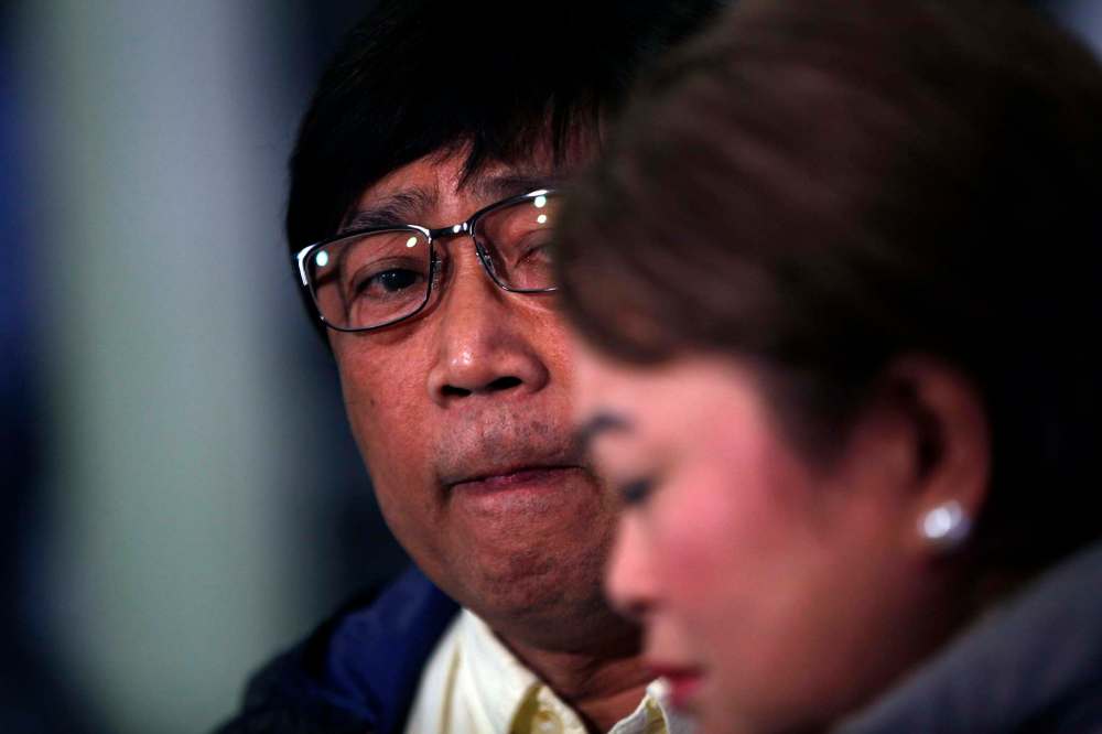 PHIL HOSSACK / WINNIPEG FREE PRESS FILES
Jaime Adao watches as his wife Imelda weeps while she describes her son and events leading to his death in March.