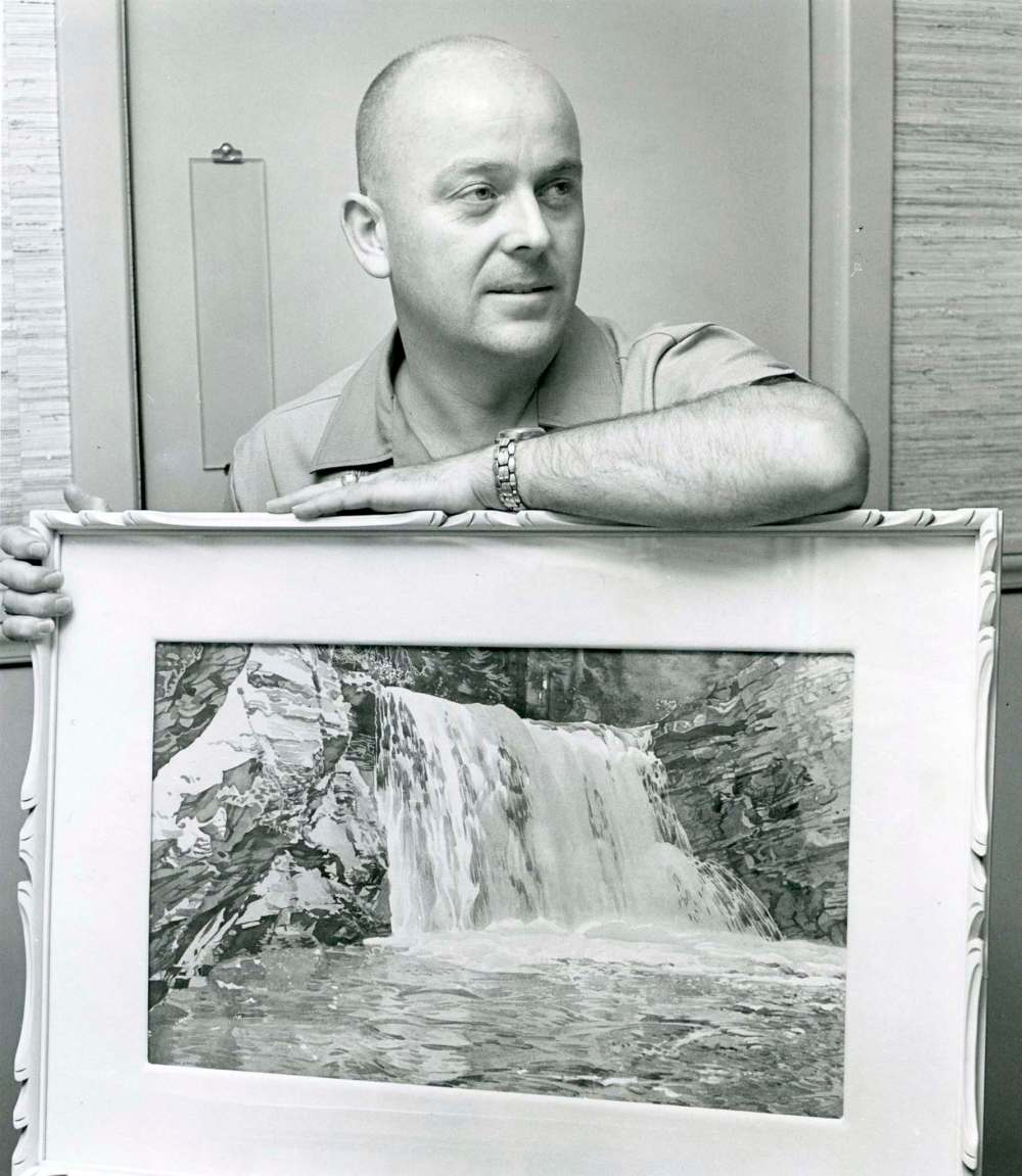 WINNIPEG FREE PRESS files
John Crabb is shown in 1967 with one of his many paintings by Walter J. Phillips.