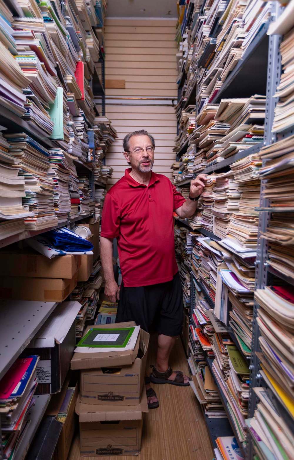 SASHA SEFTER / WINNIPEG FREE PRESS
Tredwell’s Music owner Peter Sarmatiuk among the shop’s thousands of pieces of sheet music, where there are currently 12,000 titles available online at www.tredwellsmusic.com, with another 60,000 waiting to be catalogued and posted.