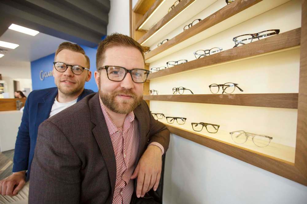 Andrew Aiken (right) and his brother Christopher (left) are making high-end glasses at low price points. (Mike Deal / Winnipeg Free Press)
