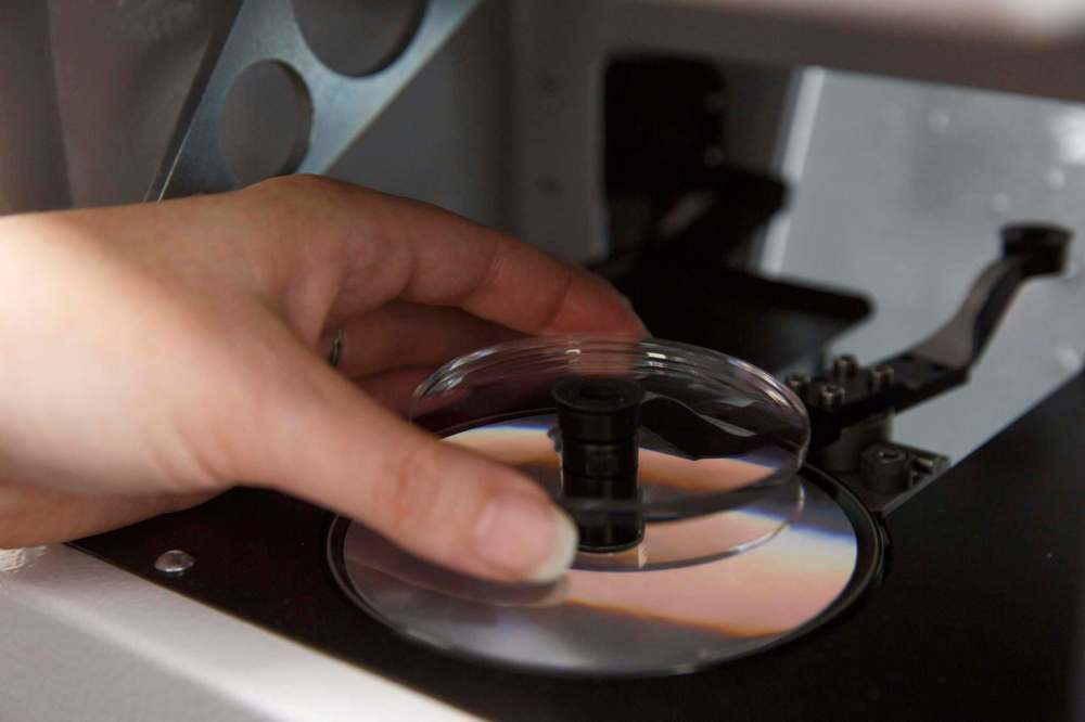 The edging system can cut 60 lenses per hour at full capacity. (Mike Deal / Winnipeg Free Press)