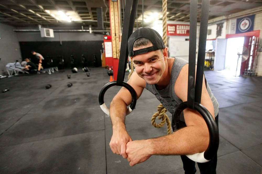 Ryan Stewart, owner of Everest Training Centre in Winnipeg, runs summer fitness classes for kids and teens at CrossFit 204 gym.