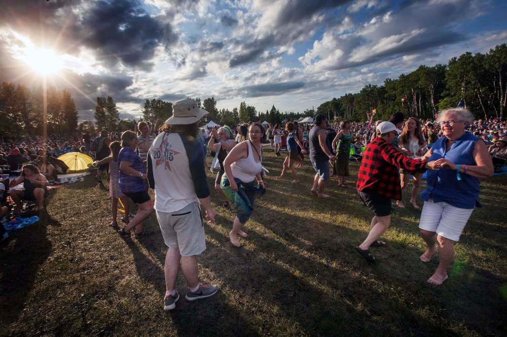 PHIL HOSSACK / WINNIPEG FREE PRESS 
Dancing the evening away as the sun sets at the Folk Festival Friday.
