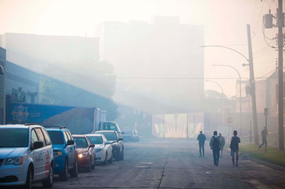 MIKAELA MACKENZIE / WINNIPEG FREE PRESS
Smoke hangs in the air from the warehouse fire on Monday.