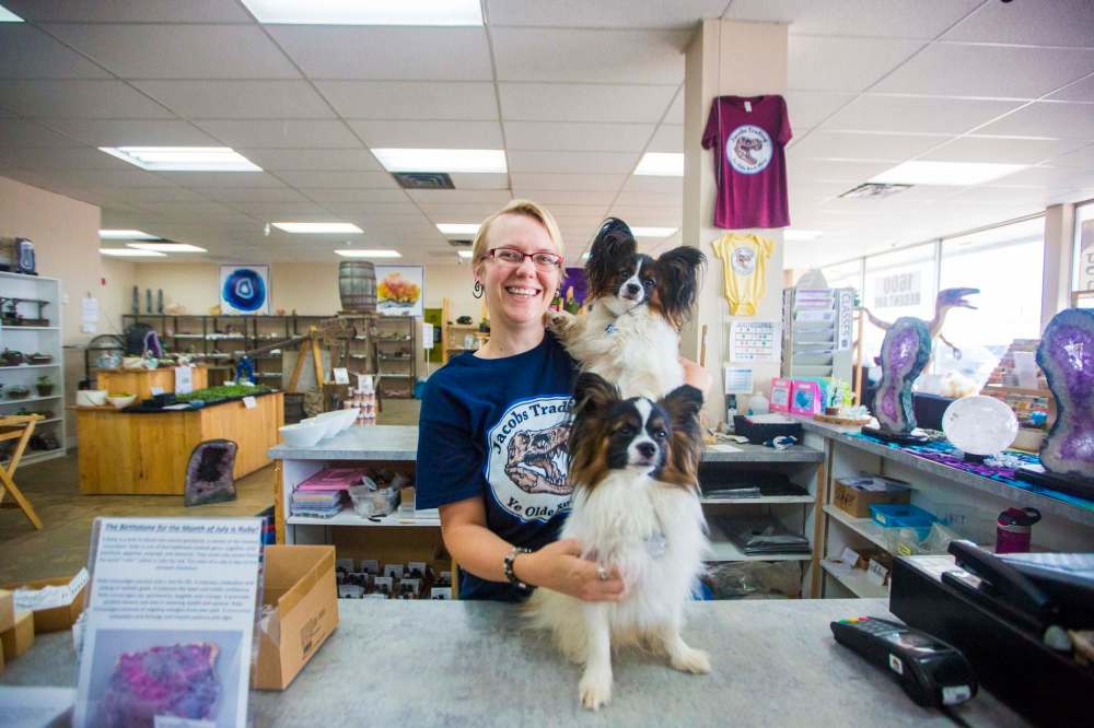MIKAELA MACKENZIE / WINNIPEG FREE PRESS
Tegan Jacobs, co-owner of Jacobs Trading, with pups Vinny and Valentino at the pet-friendly store in Winnipeg.