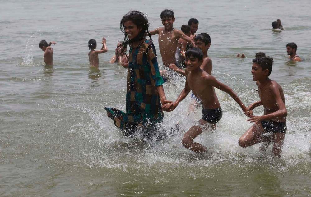 Rajesh Kumar Singh / The Associated Press files
Children play in the Ganges River on a hot day in Prayagraj, India. The Ganges was recently given rights on par with those that people enjoy.