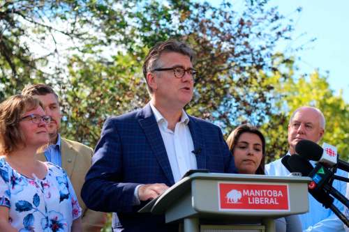 JESSICA BOTELHO-URBANSKI / WINNIPEG FREE PRESS
Surrounded by supporters at Bonnycastle Park Tuesday, Liberal Leader Dougald Lamont announced a plan to reduce poverty in Manitoba, which would include minimum-income and jobs programs.