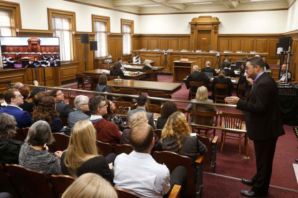 The audience packed the courtroom and cycled out in 30-minute sessions to make room for others who wanted to watch. (John Woods / The Canadian Press)