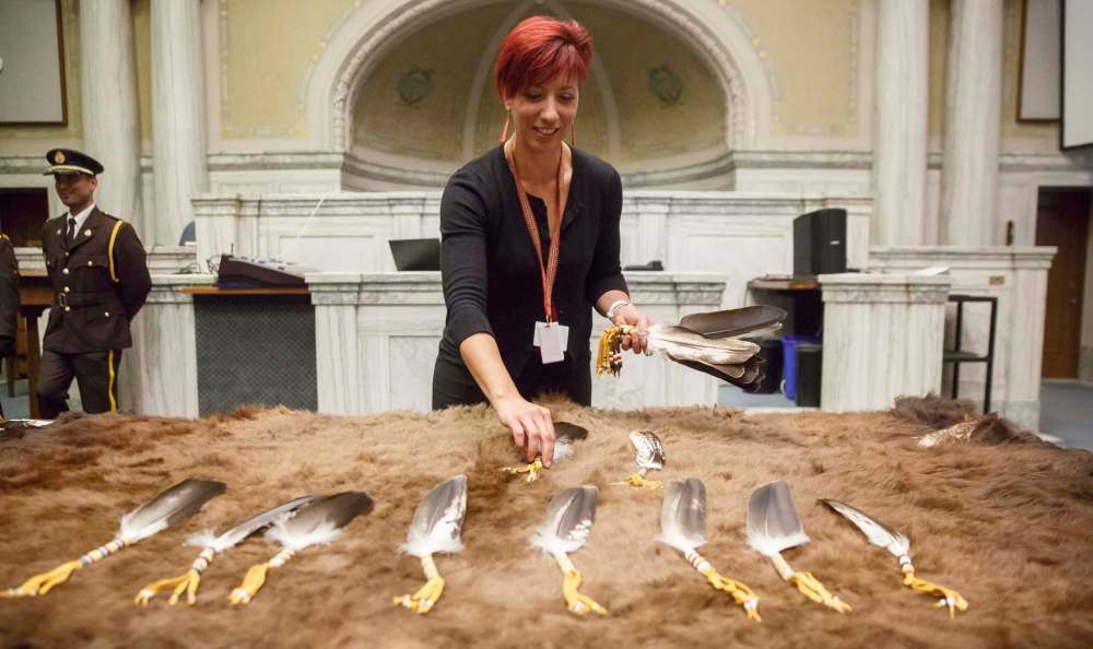 MIKE DEAL / WINNIPEG FREE PRESS
Frankie Snider, Director of Indigenous Relations at Manitoba Justice, handles the sacred eagle feathers during a presentation to the courts of The Law Courts building.